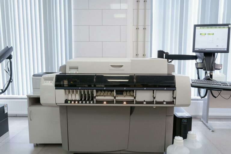 State-of-the-art digital printer in a bright, modern Rhanos print shop, showcasing advanced printing technology.
